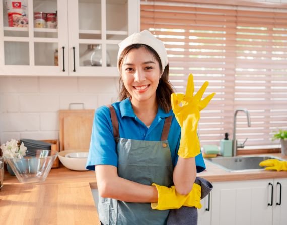 A cleaner in a bright kitchen